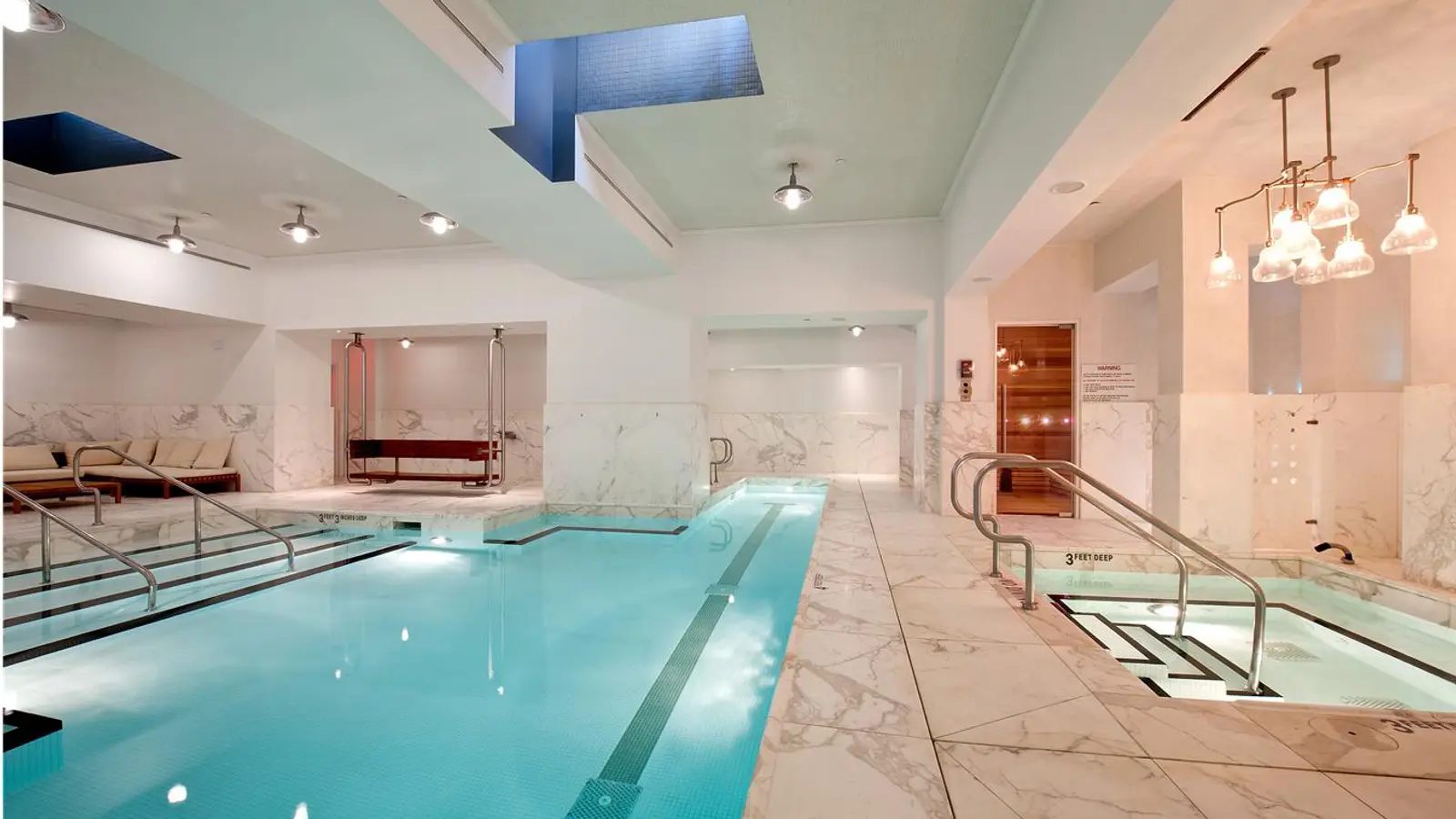 M40 spa club Carrara-marble T-shaped lap pool